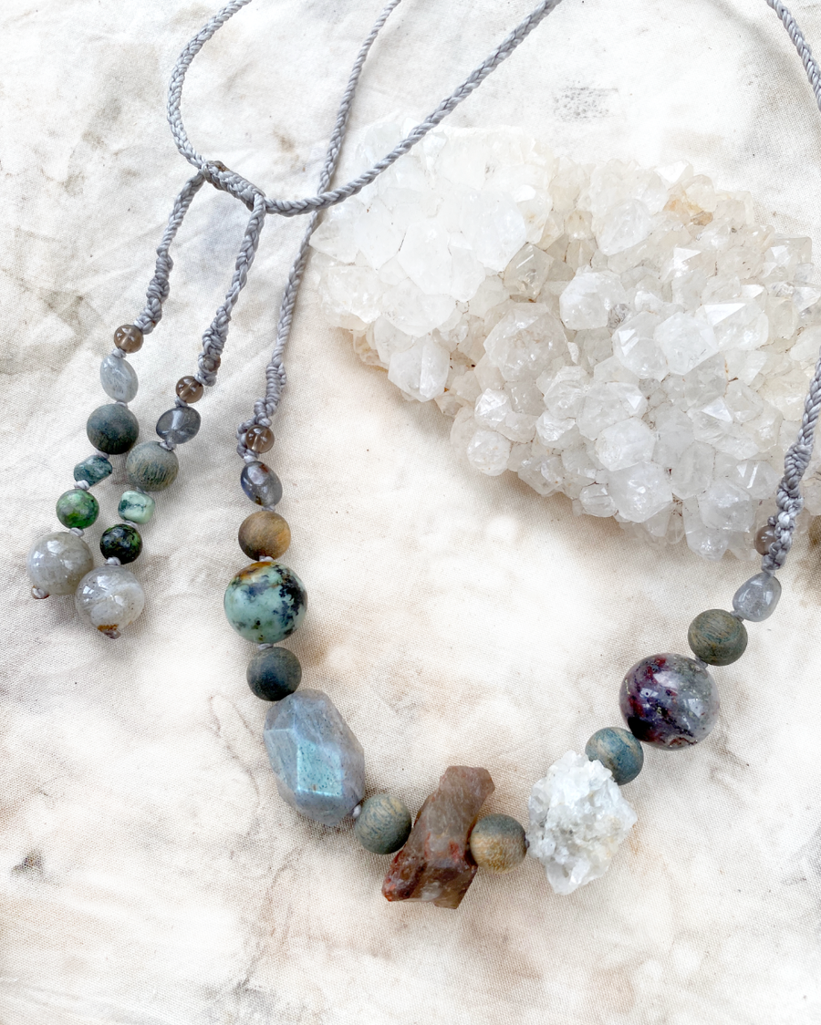 Crystal healing amulet necklace in earthy tones