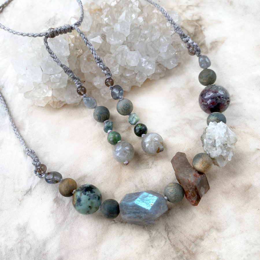 Crystal healing amulet necklace in earthy tones