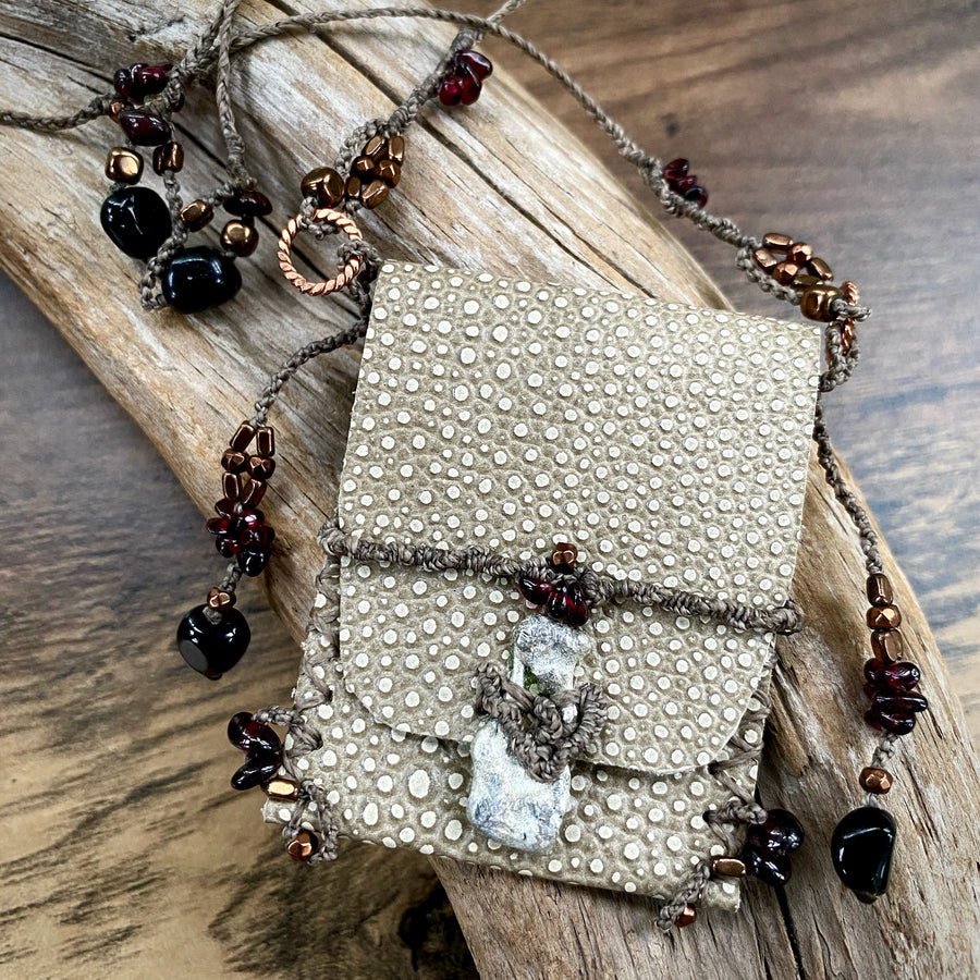 Small leather pouch necklace for carrying tiny treasures
