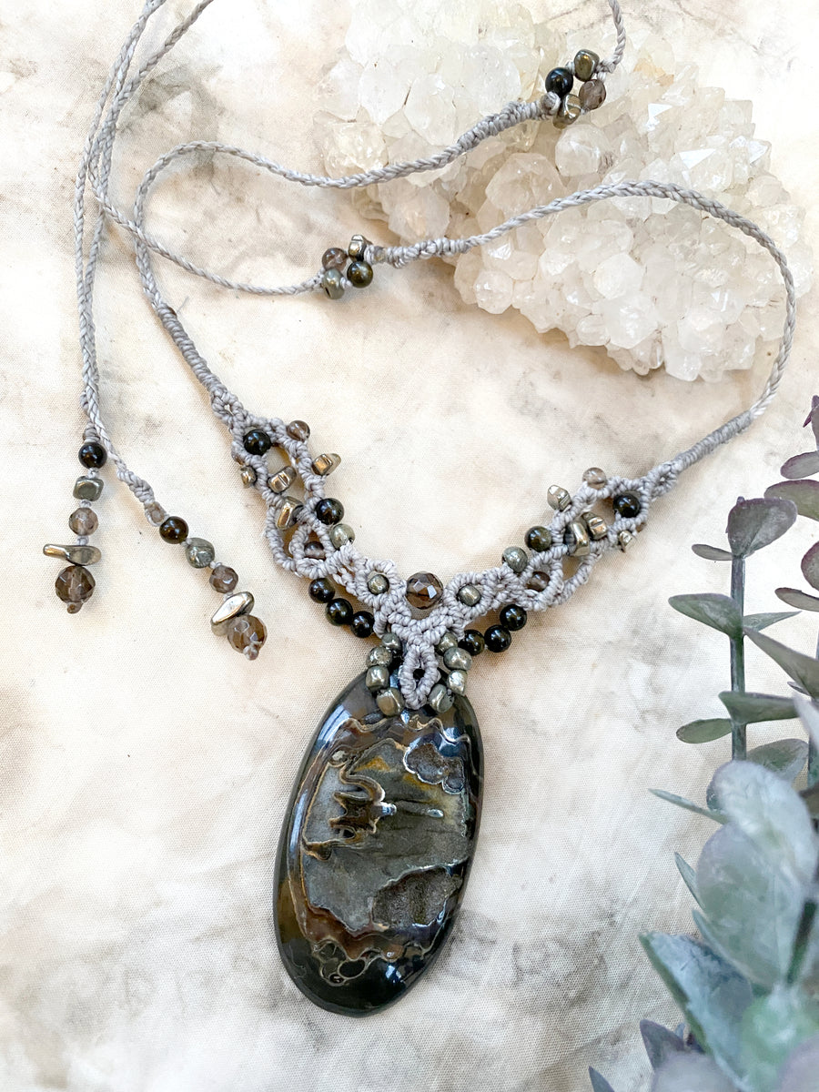 Crystal healing amulet with Pyrite in Simbircite Ammonite