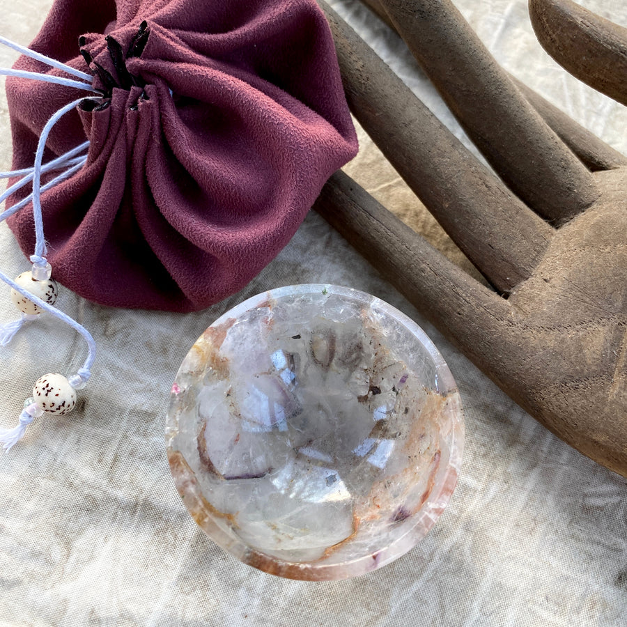 Tiny decorative crystal bowl carved from pale Amethyst with inclusions