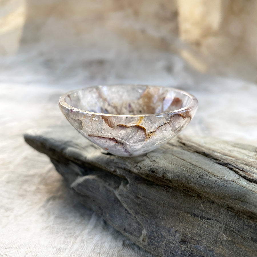 Tiny decorative crystal bowl carved from pale Amethyst with inclusions