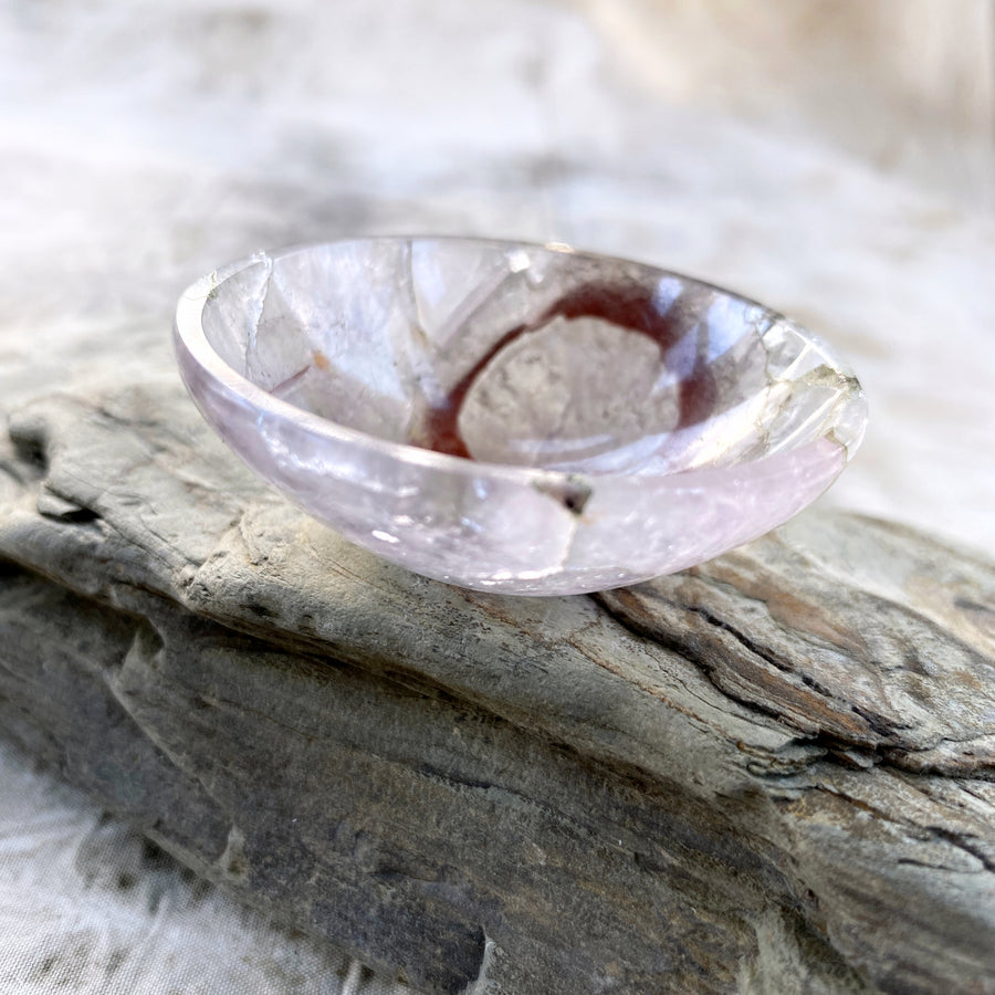 Tiny decorative crystal bowl carved from pale Amethyst with inclusions