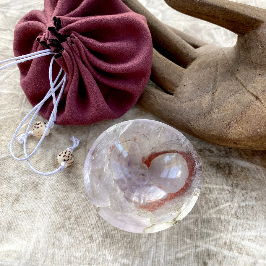 Tiny decorative crystal bowl carved from pale Amethyst with inclusions