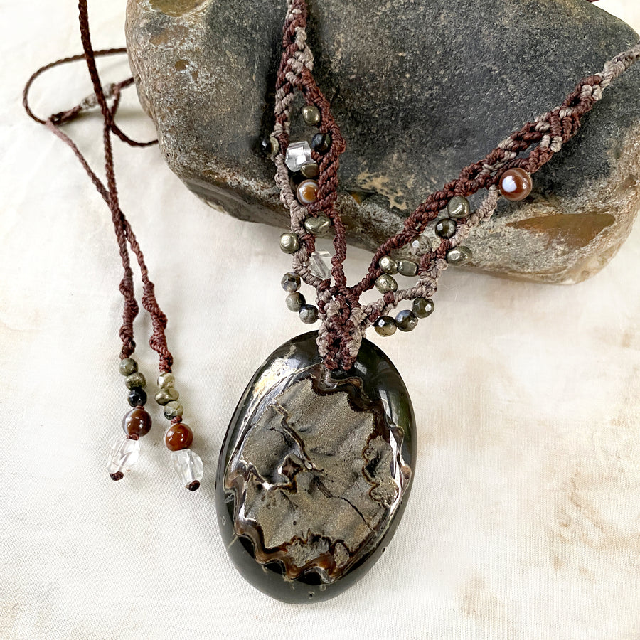 Crystal healing amulet with Pyrite in Simbircite Ammonite
