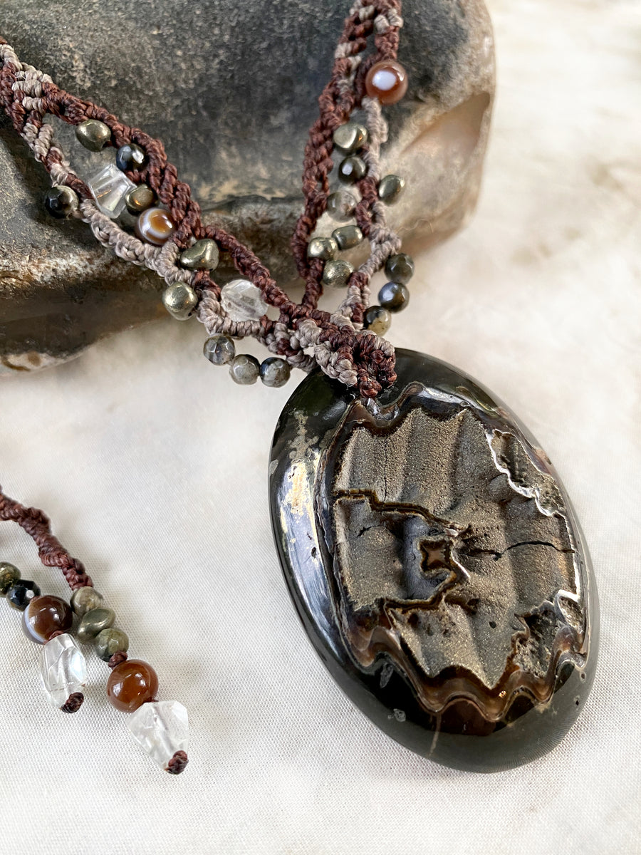 Crystal healing amulet with Pyrite in Simbircite Ammonite