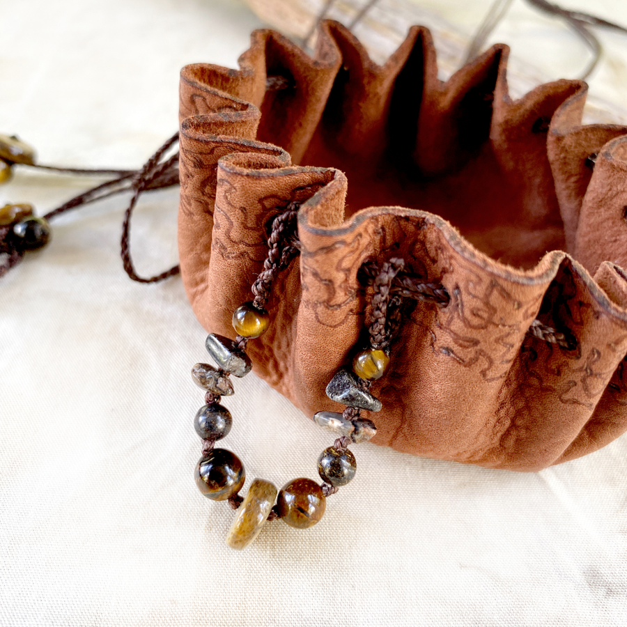 Small leather pouch necklace for carrying tiny treasures