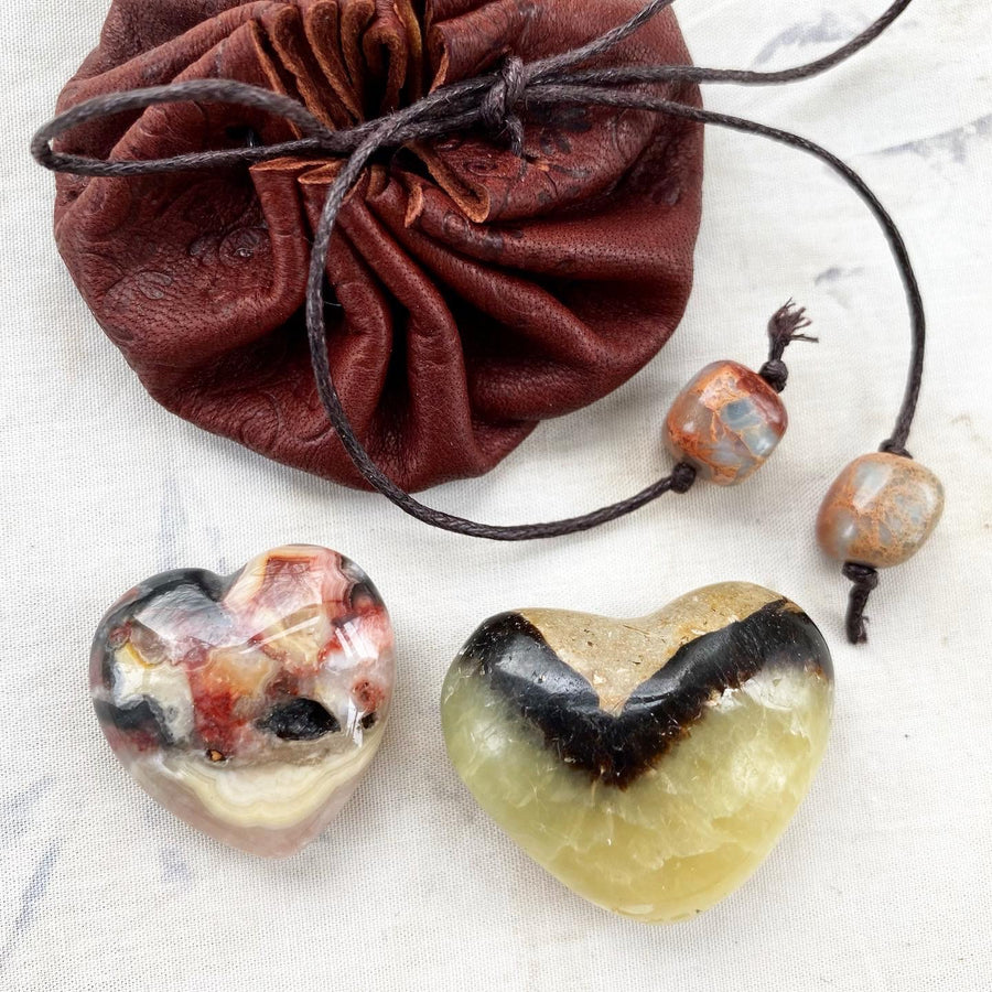 Leather pouch with a pair of crystal hearts ~ Crazy Lace Agate & Septarian