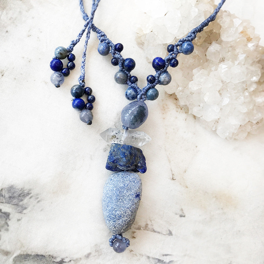 Cairn amulet with blue crystal energy