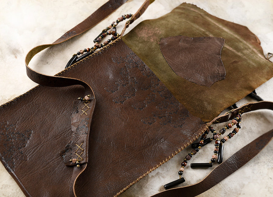 Tribal style dark brown leather bag, fully hand-stitched with crystal details