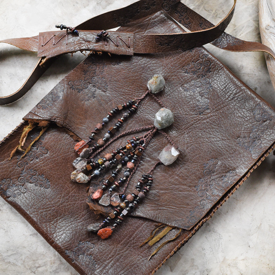 Tribal style dark brown leather bag, fully hand-stitched with crystal details