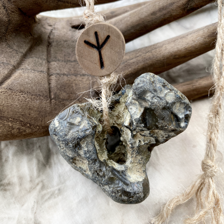 Flint hagstone ('holey' stone) with Algiz rune