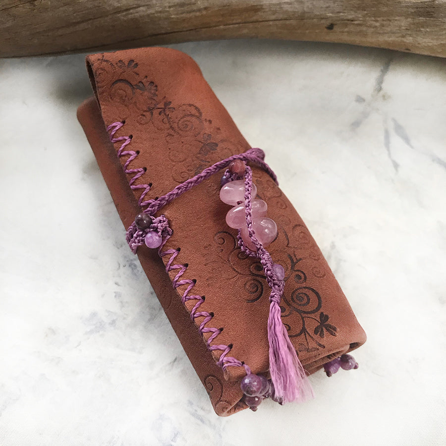 Tribal style leather roll for carrying crystal tools ~ with Rose Quartz toggle