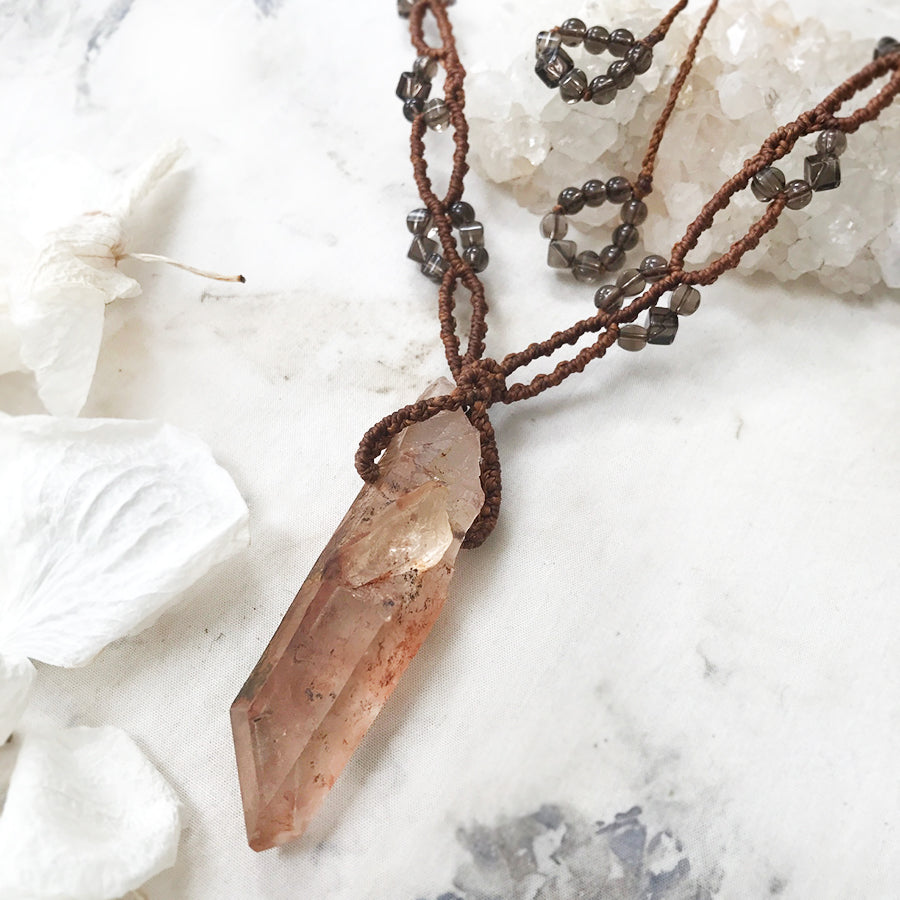 Crystal healing amulet with Hematite included raw Quartz point