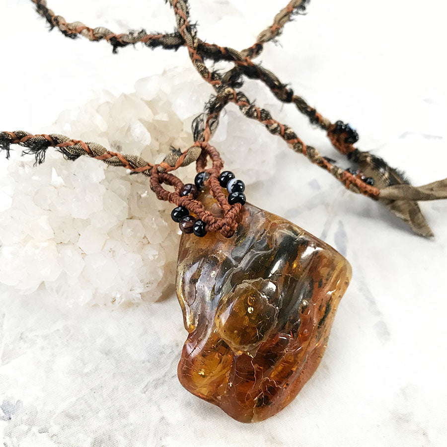 Amber crystal healing talisman