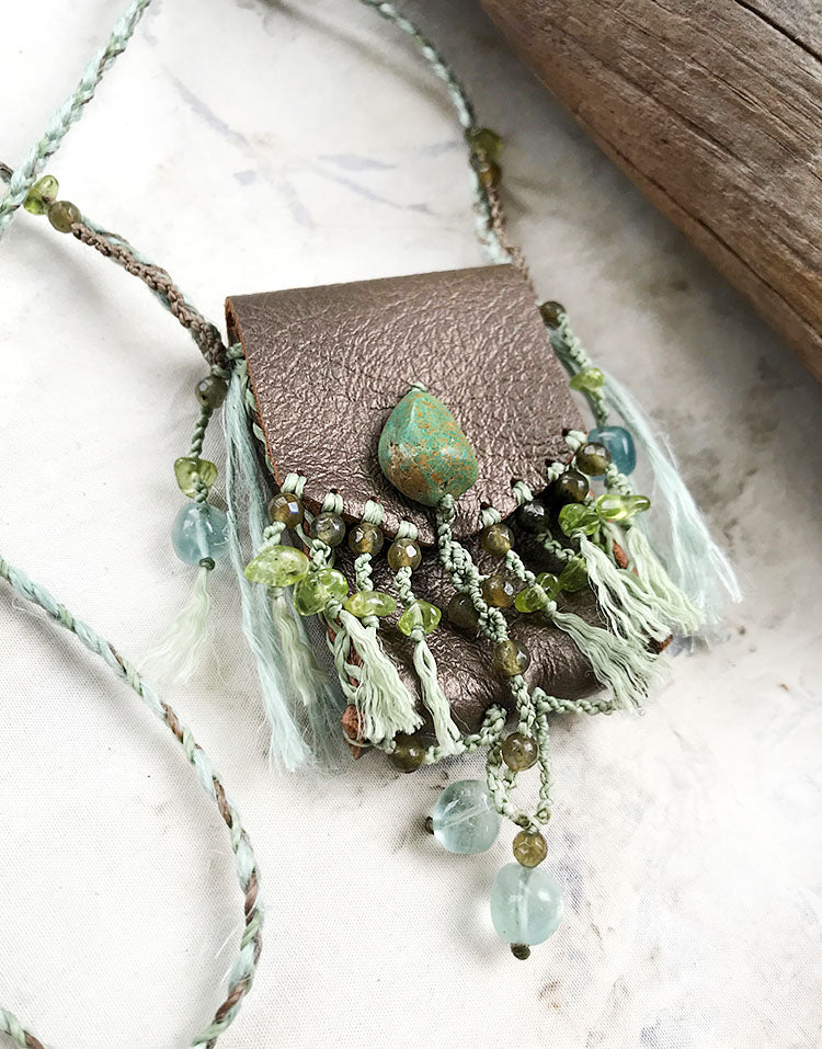 Tribal style leather pouch necklace with crystal detailing