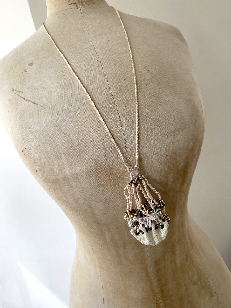 Luxurious crystal pod necklace for carrying loose crystals