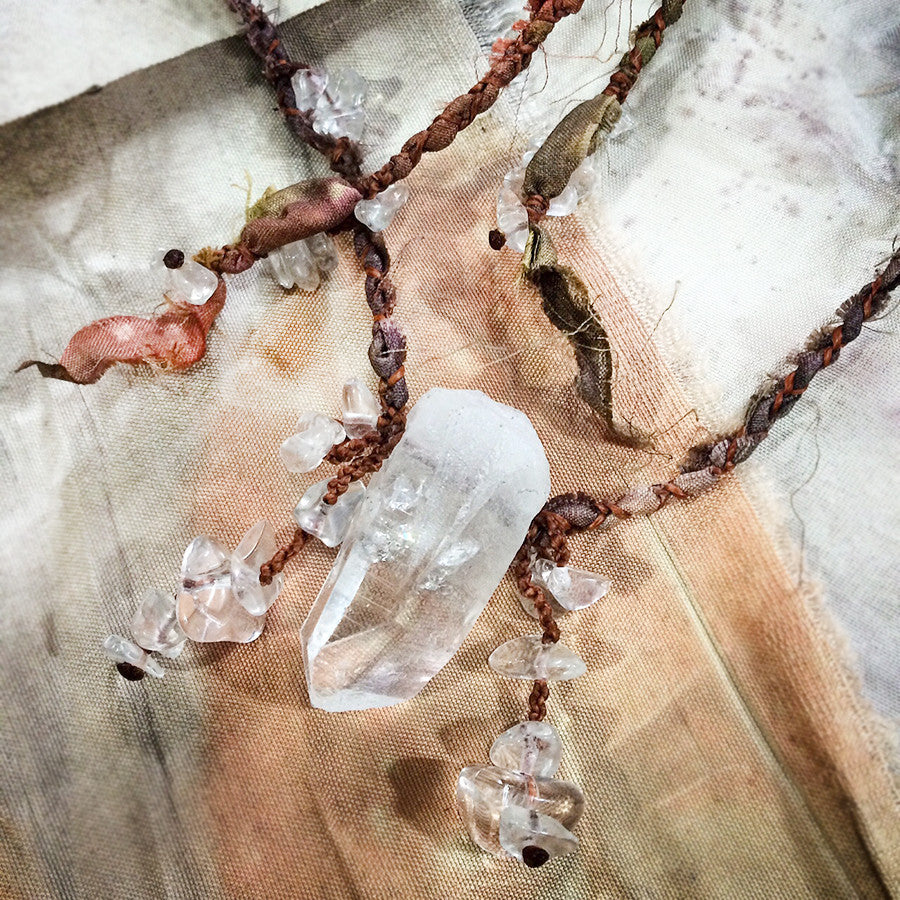 Quartz crystal healing amulet in silk braid