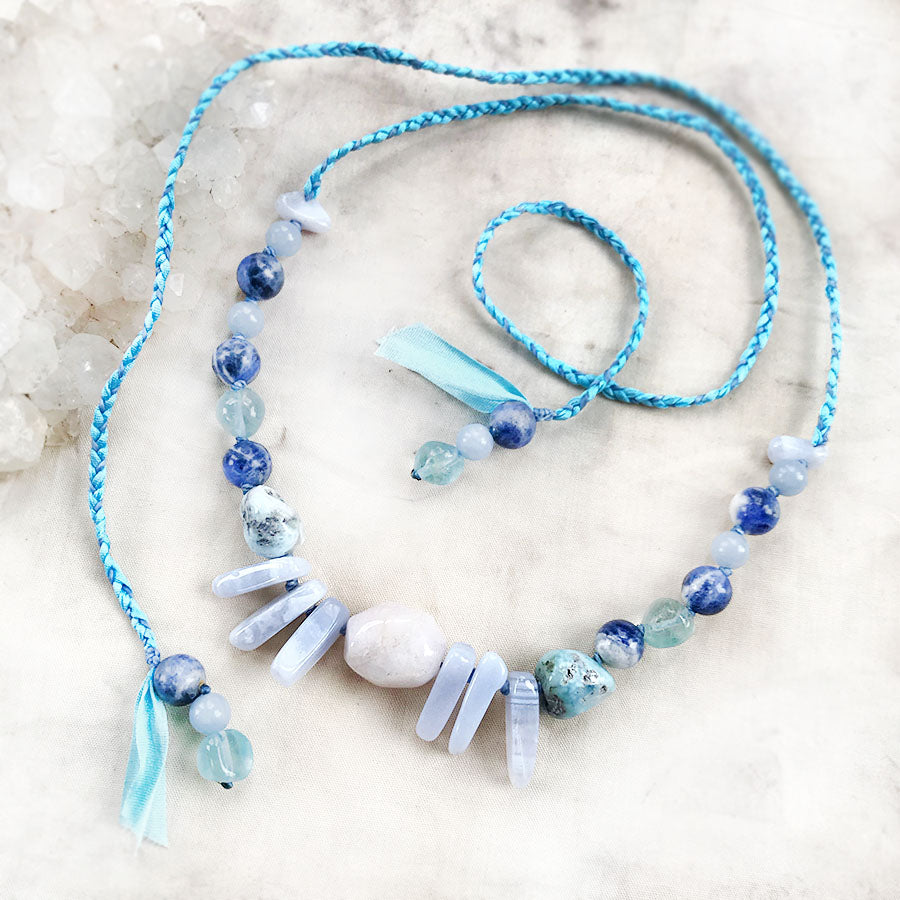 Crystal healing amulet in gentle blue tones