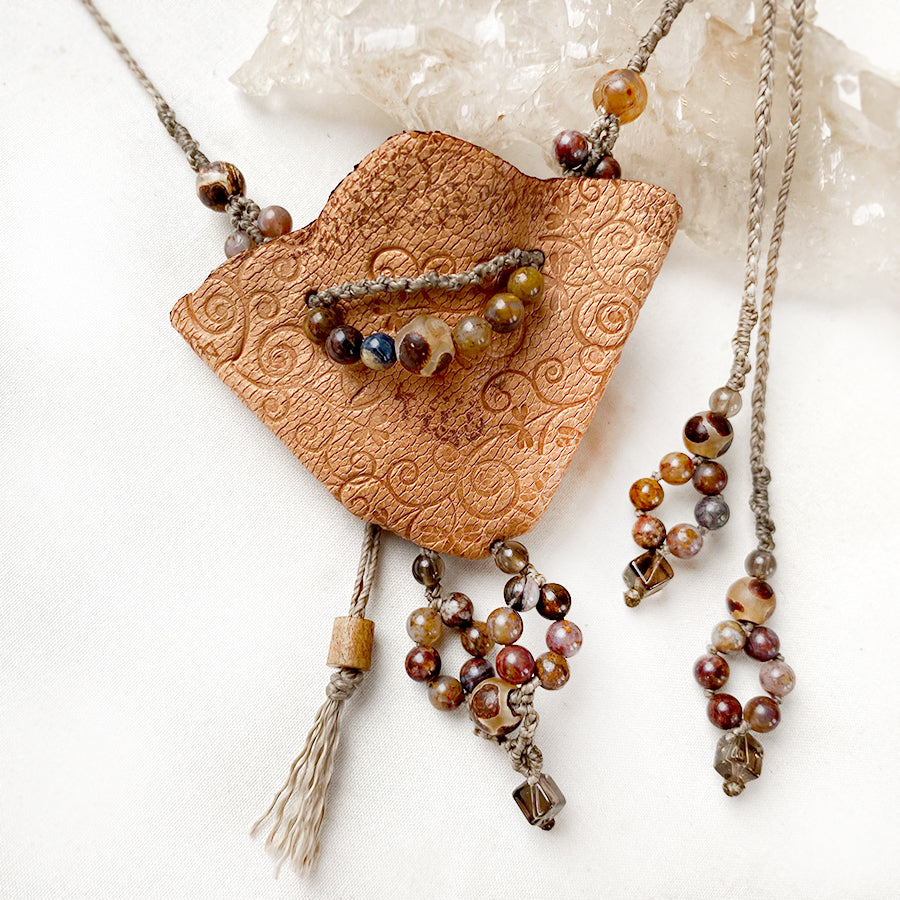Small leather pouch necklace with crystal detailing