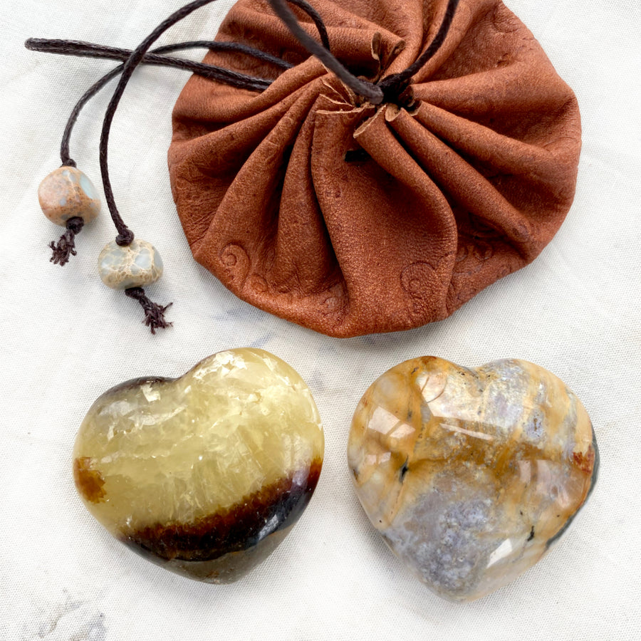 Leather pouch with a pair of crystal hearts ~ Wood Agate & Septarian